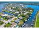 Aerial view of waterfront homes featuring boat docks and lush landscaping in a desirable coastal community at 8211 Brent St # 815, Port Richey, FL 34668