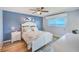 This bedroom features a beachy vibe with blue accents, luxury vinyl plank flooring and plenty of light at 8211 Brent St # 815, Port Richey, FL 34668