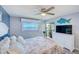 Bright bedroom features luxury vinyl plank flooring and a window with a water view at 8211 Brent St # 815, Port Richey, FL 34668