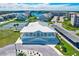 An aerial view of a clubhouse with tennis courts at 8211 Brent St # 815, Port Richey, FL 34668