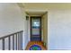 Charming front door with decorative glass, house number, and a unique welcome mat and decor at 8211 Brent St # 815, Port Richey, FL 34668