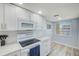 Well-equipped kitchen with modern appliances, ample counter space, and a window for natural light at 8211 Brent St # 815, Port Richey, FL 34668