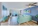 Inviting living room with comfortable seating, stylish decor, and a sliding glass door to the balcony at 8211 Brent St # 815, Port Richey, FL 34668