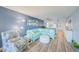 Bright living room with a large sectional sofa, stylish decor, and an open view to the kitchen at 8211 Brent St # 815, Port Richey, FL 34668