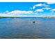 Breathtaking waterfront vista featuring tranquil waters and clear blue skies, providing an ideal serene backdrop at 8211 Brent St # 815, Port Richey, FL 34668