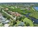 Panoramic aerial view showcasing the property's prime location with golf course, ponds, and waterways at 8707 Silverthorn Rd, Seminole, FL 33777