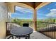 Relaxing balcony with table and seating offering serene views of the lush landscape at 8707 Silverthorn Rd, Seminole, FL 33777