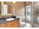 Bathroom featuring granite countertop, and a glass-enclosed walk-in shower at 8707 Silverthorn Rd, Seminole, FL 33777