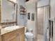 Bright and neutral bathroom with granite countertops and walk in shower at 8707 Silverthorn Rd, Seminole, FL 33777