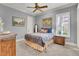 Comfortable bedroom with bright neutral paint and a queen sized bed at 8707 Silverthorn Rd, Seminole, FL 33777