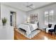 Bright bedroom with large window, neutral decor, and hardwood floors, offering a serene atmosphere at 8707 Silverthorn Rd, Seminole, FL 33777