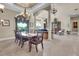 Elegant dining room showcasing spacious layout with marble floors, stylish chandelier, and natural light at 8707 Silverthorn Rd, Seminole, FL 33777