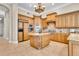 Gourmet kitchen with custom wood cabinetry, granite countertops, and high-end appliances at 8707 Silverthorn Rd, Seminole, FL 33777