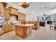 Spacious kitchen seamlessly connected to the living area, showcasing modern appliances and stone counters at 8707 Silverthorn Rd, Seminole, FL 33777