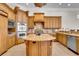 Spacious kitchen features custom cabinets, a large island, and stainless steel appliances at 8707 Silverthorn Rd, Seminole, FL 33777