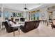 This living room has a fireplace, tile floors, and sliding doors to the pool at 8707 Silverthorn Rd, Seminole, FL 33777