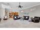 Open floor plan living room and kitchen area features tile floors and modern décor at 8707 Silverthorn Rd, Seminole, FL 33777