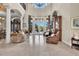 Bright living room with high ceilings, elegant decor, marble floors, and floor to ceiling windows at 8707 Silverthorn Rd, Seminole, FL 33777