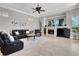This living room has a fireplace, tile floors, and sliding doors to the pool at 8707 Silverthorn Rd, Seminole, FL 33777