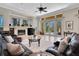 This living room has a fireplace, tile floors, and sliding doors to the pool at 8707 Silverthorn Rd, Seminole, FL 33777