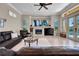 This living room has a fireplace, tile floors, and sliding doors to the pool at 8707 Silverthorn Rd, Seminole, FL 33777