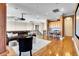 Open-concept living room with hardwood floors, projector, and wet bar, great for entertaining guests at 8707 Silverthorn Rd, Seminole, FL 33777