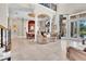 Open-concept design seamlessly connects living and dining areas with large windows and natural light at 8707 Silverthorn Rd, Seminole, FL 33777
