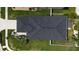 Aerial view of a home with a dark shingle roof and well-manicured landscaping at 9110 Lantern Oak Way, Land O Lakes, FL 34638