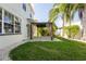 Backyard view with pergola and tropical landscape at 9110 Lantern Oak Way, Land O Lakes, FL 34638