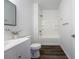 Bathroom featuring modern fixtures, sleek vanity, and a combined shower and bathtub at 9110 Lantern Oak Way, Land O Lakes, FL 34638