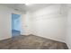 Carpeted walk-in closet includes wire shelving for efficient storage and organization at 9110 Lantern Oak Way, Land O Lakes, FL 34638