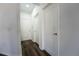 Bright hallway with sleek flooring and freshly painted walls at 9110 Lantern Oak Way, Land O Lakes, FL 34638