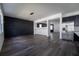 Spacious living area features dark hardwood floors and a modern, open layout at 9110 Lantern Oak Way, Land O Lakes, FL 34638