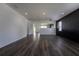 Spacious living room featuring sleek flooring, modern lighting, and freshly painted walls at 9110 Lantern Oak Way, Land O Lakes, FL 34638