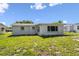 The home boasts a spacious backyard with ample green space, perfect for outdoor activities and relaxation at 10831 Manchester Rd, Port Richey, FL 34668