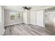 Spacious bedroom featuring hardwood floors, neutral paint, and two separate closets at 10831 Manchester Rd, Port Richey, FL 34668