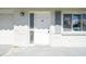 A well-maintained front entrance features a solid door, glass window, and secure access at 10831 Manchester Rd, Port Richey, FL 34668