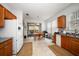 Functional kitchen featuring wooden cabinets, tiled floors, and access to the patio at 10921 Cory Lake Dr, Tampa, FL 33647