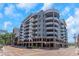Modern condo building with balconies, brick accents and street view, perfect for urban living at 1108 N Franklin St # 602, Tampa, FL 33602