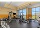 Modern gym with natural light, treadmills, weights, and exercise equipment for a complete workout experience at 1108 N Franklin St # 602, Tampa, FL 33602
