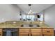 Open concept kitchen features granite countertops and stainless steel sink at 1108 N Franklin St # 602, Tampa, FL 33602