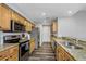 Updated kitchen features stainless steel appliances, granite countertops and wood-look flooring at 1108 N Franklin St # 602, Tampa, FL 33602