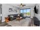 Modern living room with stylish leather sofa, balcony access, and neutral color palette at 1108 N Franklin St # 602, Tampa, FL 33602