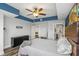 Bedroom with wood-look floors, a ceiling fan, and ensuite bathroom and walk-in closet at 1108 N Franklin St # 602, Tampa, FL 33602