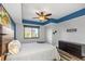 This bedroom features wood-look floors, ceiling fan, and a large window at 1108 N Franklin St # 602, Tampa, FL 33602