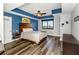 This main bedroom boasts wood-look flooring, a ceiling fan, and modern decor at 1108 N Franklin St # 602, Tampa, FL 33602