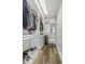 Modern walk-in closet with custom shelving, drawers, and organized storage for clothing and accessories at 1108 N Franklin St # 602, Tampa, FL 33602