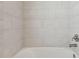 Clean and bright shower with large white tiles and modern fixture at 11311 Striped Bass Ct, New Port Richey, FL 34654