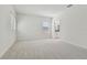Large carpeted bedroom with an ensuite bathroom at 11311 Striped Bass Ct, New Port Richey, FL 34654