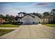 Lovely two-story home with a three car garage, featuring a manicured lawn at 11311 Striped Bass Ct, New Port Richey, FL 34654